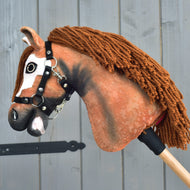 Side view of the chestnut Cloud Hobby Horse with shaded neck, long brown yarn mane and black nylon halter