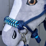 Close-up of a Hobby Horse LarDen plush toy wearing the Rope set navy, a blue and white braided halter and lead rope. Detailed stitching shapes the eye and nose, while reins add an authentic touch.