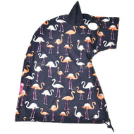 The Hobby Horse LarDen Protective Suit Lycra Flamingo is a navy blue hooded cape or blanket with white and orange flamingos, soft lycra fabric, small ear detail on the hood, and an adjustable drawstring at the bottom.