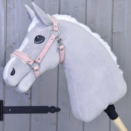 Light grey Hobby Horse with white mane wearing the dusty pink leatherette halter with cream fur trim