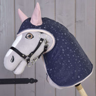 The Hobby Horse LarDen Raincoat Pinkie Blue (softshell) features a gray and white hobby horse with pink ears and a navy rain-patterned coat, black bridle, perfect for all weather play, shown against light wooden paneling.