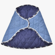 The Blanket Beautiful Jeans by Hobby Horse LarDen is a quilted blue and navy pet coat with white trim and plaid edging, featuring a curved, overlapping design and diamond stitching, shown flat on a white background.