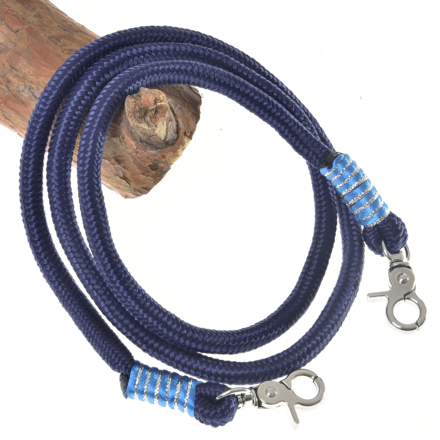 The Reins Blues by Hobby Horse LarDen is a coiled dark blue polypropylene rope leash with metal clasps at both ends and blue-white striped accents, shown on a light background—ideal as handmade hobby horse reins.