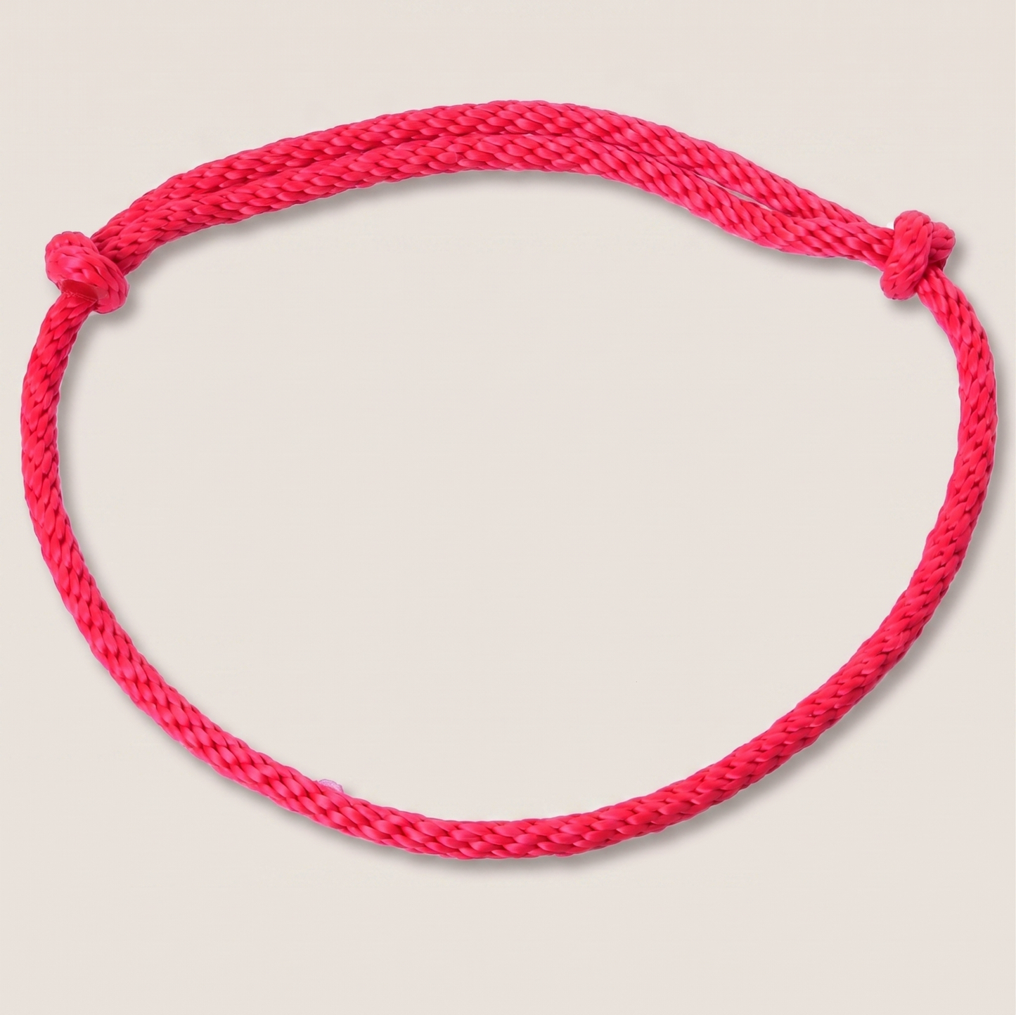 The Cordeo red (size S) by Hobby Horse LarDen is a handcrafted red rope bracelet with end knots, forming a closed loop and shown on a white background.