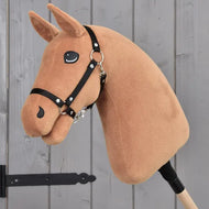 The Build your horse by related_to_12441055625556 is a plush chestnut hobby horse head with a black bridle, button eyes, chocolate yarn mane, and a friendly look, mounted on a stick.