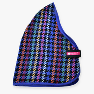 The Hobby Horse LarDen Stable Blanket Peru features a colorful houndstooth pattern with blue trim, black strap, and pink-and-white LarDen logo tag. The fabric mixes vibrant red, yellow, green, and blue tones.