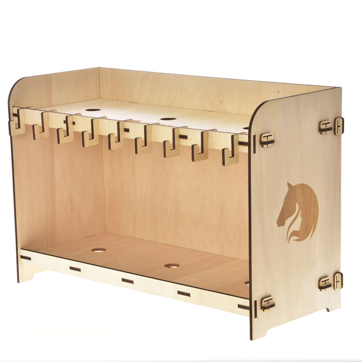 The Hobby Horse LarDen Stable for 3 Hobby Horses features notched slots on top, open sides, and a horse head silhouette on one side—perfect for organizing or displaying hobby horses.